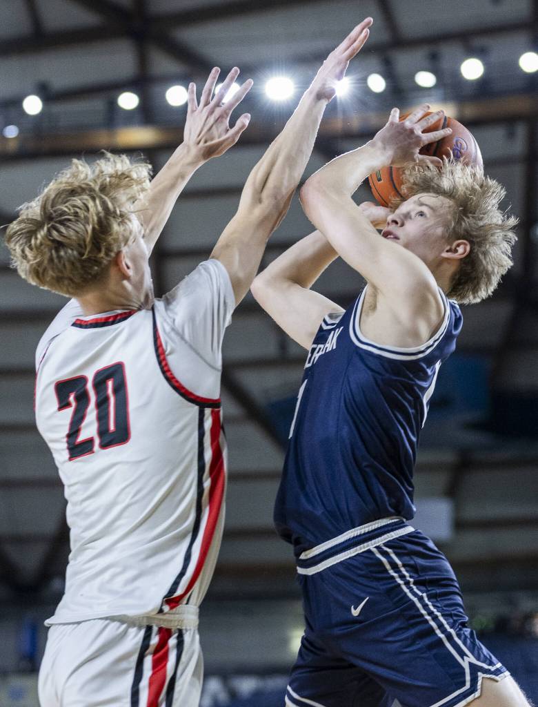 Glacier Peaks Reed Nagel makes a layup while being guarded during the 4A boys quarterfinal game against Camas on Thursday, March 6, 2025 in Tacoma, Washington. (Olivia Vanni / The Herald)