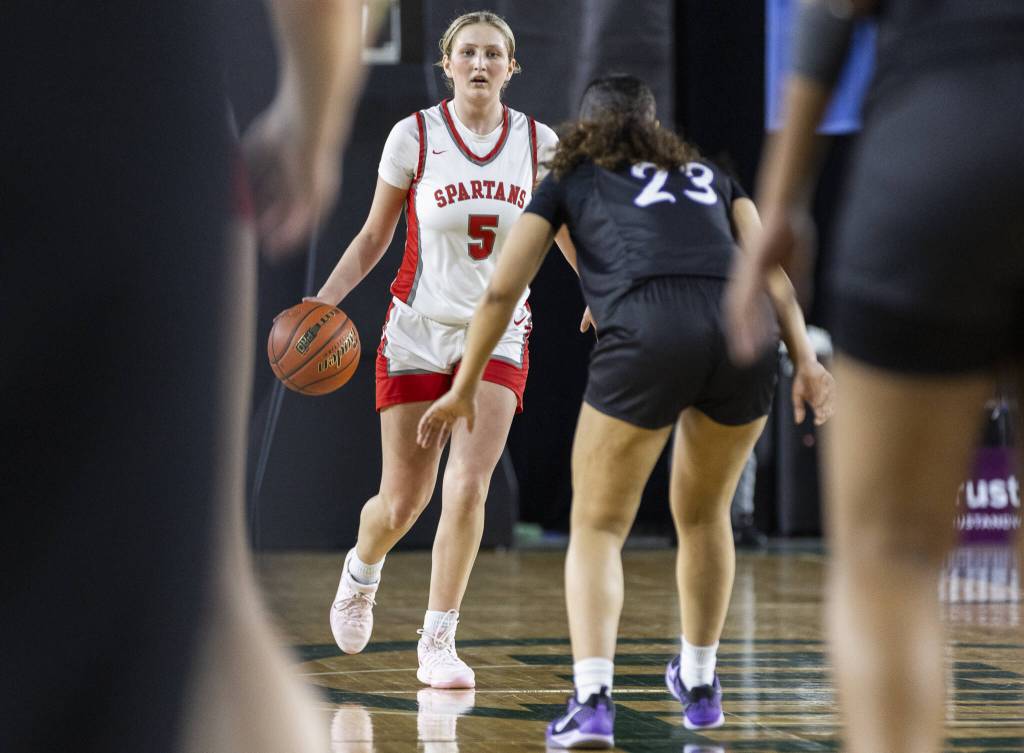 Stanwoods Ava DePew takes the ball down the court during the 3A girls quarterfinal game against Garfield on Thursday, March 6, 2025 in Tacoma, Washington. (Olivia Vanni / The Herald)