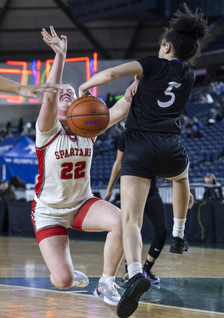 Stanwoods Jazmyn Legg has the ball knocked away while attempting a layup during the 3A girls quarterfinal game against Garfield on Thursday, March 6, 2025 in Tacoma, Washington. (Olivia Vanni / The Herald)