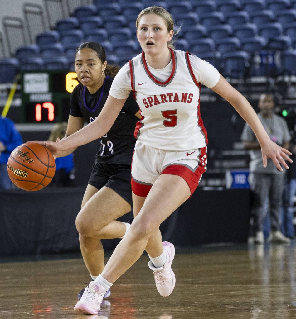 Stanwoods Ava DePew takes the ball down the court during the 3A girls quarterfinal game against Garfield on Thursday, March 6, 2025 in Tacoma, Washington. (Olivia Vanni / The Herald)