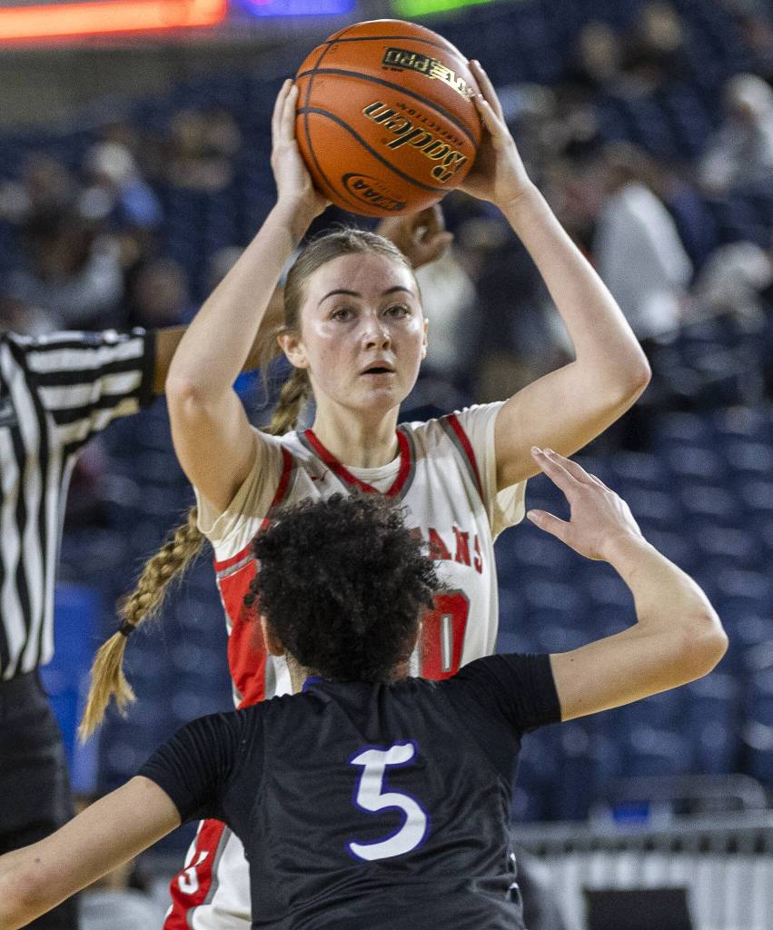 Stanwoods Presley Harris looks for a teammate to pass to during the 3A girls quarterfinal game against Garfield on Thursday, March 6, 2025 in Tacoma, Washington. (Olivia Vanni / The Herald)