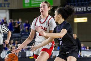 Stanwood's Ellalee Wortham takes the ball down the court during the 3A girls quarterfinal game against Garfield on Thursday, March 6, 2025 in Tacoma, Washington. (Olivia Vanni / The Herald)