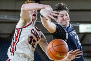 Glacier Peak’s Zachary Albright reaches out for a rebound during the 4A boys quarterfinal game against Camas on Thursday, March 6, 2025 in Tacoma, Washington. (Olivia Vanni / The Herald)