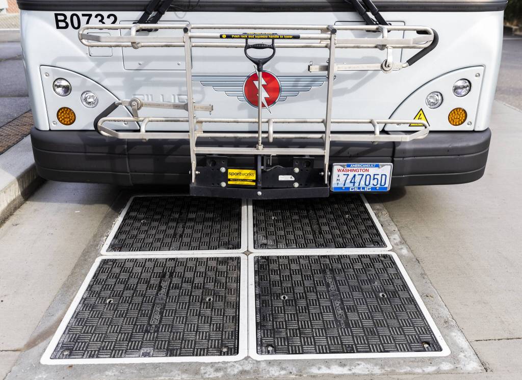 Induction charging pads in front of one of Everett Transits electric buses on Monday, March 10, 2025 in Everett, Washington (Olivia Vanni / The Herald)