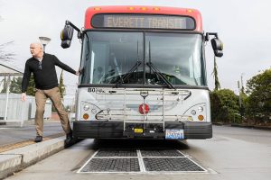 Everett Transit Director Mike Schmieder talks about how the buses are able to lower themselves onto the induction chargers on Monday, March 10, 2025 in Everett, Washington. (Olivia Vanni / The Herald)
