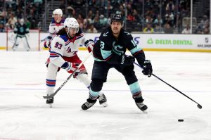 Brandon Tanev (13) of the Seattle Kraken skates against the New York Rangers during the second period at Climate Pledge Arena on Sunday, Nov. 17, 2024, in Seattle. (Steph Chambers / Getty Images / Tribune News Services)