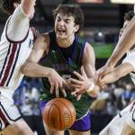 Edmonds-Woodways Cameron Hiatt has the ball knocked out of his hands during the 3A boys semifinal game against Mt. Spokane on Friday, March 7, 2025 in Tacoma, Washington. (Olivia Vanni / The Herald)