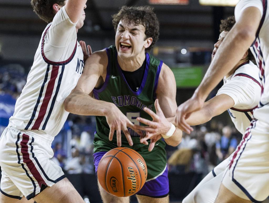 Edmonds-Woodways Cameron Hiatt has the ball knocked out of his hands during the 3A boys semifinal game against Mt. Spokane on Friday, March 7, 2025 in Tacoma, Washington. (Olivia Vanni / The Herald)