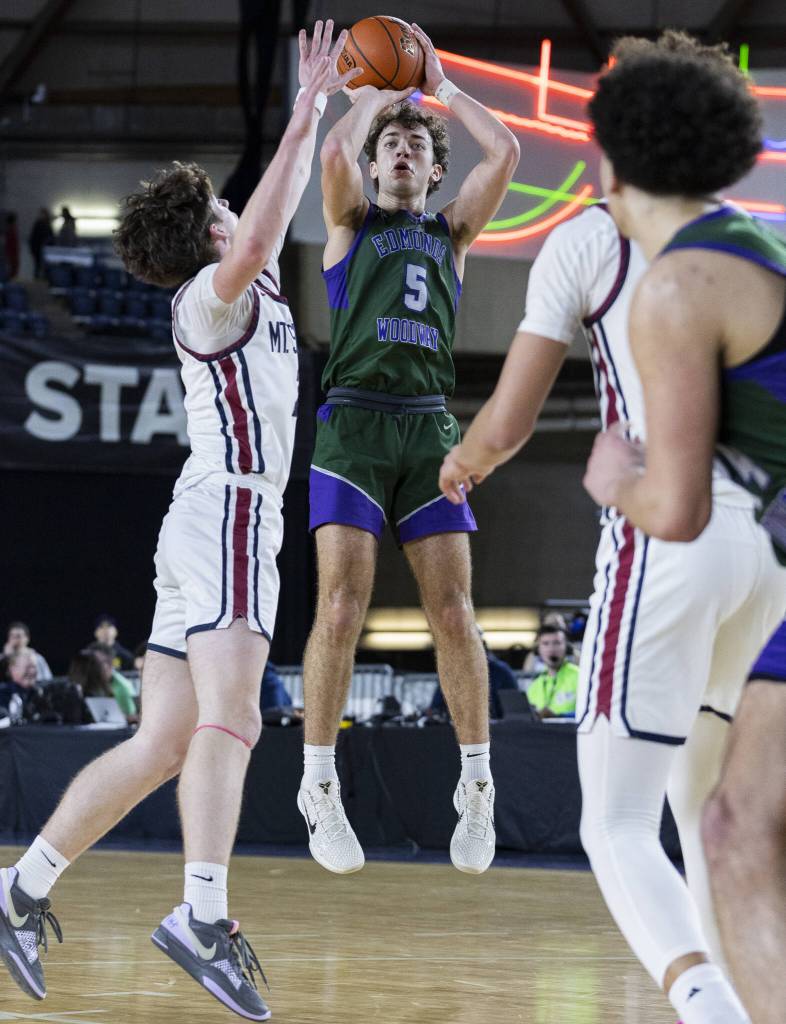 Edmonds-Woodways Cameron Hiatt makes a three-point shot during the 3A boys semifinal game against Mt. Spokane on Friday, March 7, 2025 in Tacoma, Washington. (Olivia Vanni / The Herald)