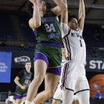 Edmonds-Woodways Julian Gray jumps in the air to make a layup during the 3A boys semifinal game against Mt. Spokane on Friday, March 7, 2025 in Tacoma, Washington. (Olivia Vanni / The Herald)