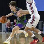 Edmonds-Woodways DJ Karl takes the ball down the court during the 3A boys semifinal game against Mt. Spokane on Friday, March 7, 2025 in Tacoma, Washington. (Olivia Vanni / The Herald)