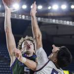 Edmonds-Woodways Cameron Hiatt reaches up to make a layup during the 3A boys semifinal game against Mt. Spokane on Friday, March 7, 2025 in Tacoma, Washington. (Olivia Vanni / The Herald)