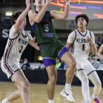 Edmonds-Woodways Cameron Hiatt reaches up to make a layup during the 3A boys semifinal game against Mt. Spokane on Friday, March 7, 2025 in Tacoma, Washington. (Olivia Vanni / The Herald)