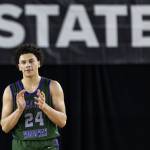 Edmonds-Woodways Julian Gray claps as he walks off the court after fouling out during the 3A boys semifinal game against Mt. Spokane on Friday, March 7, 2025 in Tacoma, Washington. (Olivia Vanni / The Herald)