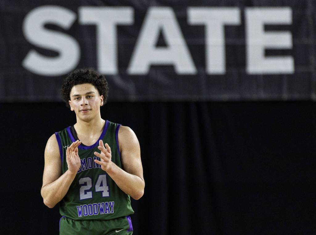 Edmonds-Woodways Julian Gray claps as he walks off the court after fouling out during the 3A boys semifinal game against Mt. Spokane on Friday, March 7, 2025 in Tacoma, Washington. (Olivia Vanni / The Herald)