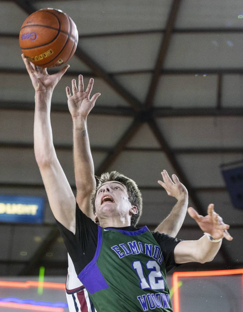 Edmonds-Woodways William Alseth makes a layup during the 3A boys semifinal game against Mt. Spokane on Friday, March 7, 2025 in Tacoma, Washington. (Olivia Vanni / The Herald)