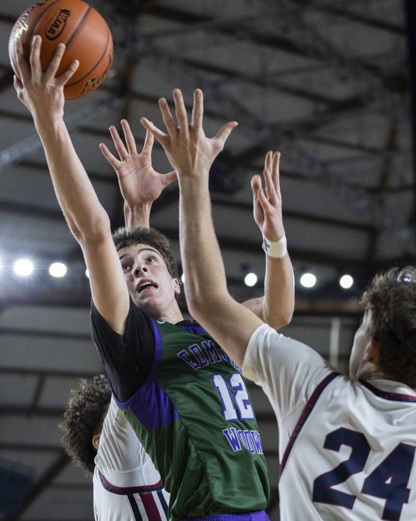 Edmonds-Woodways William Alseth reaches up to make a layup during the 3A boys semifinal game against Mt. Spokane on Friday, March 7, 2025 in Tacoma, Washington. (Olivia Vanni / The Herald)