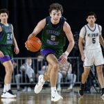 Edmonds-Woodway’s Cam Hiatt takes the ball down the court during the 3A boys semifinal game against Mt. Spokane on Friday, March 7, 2025 in Tacoma, Washington. (Olivia Vanni / The Herald)