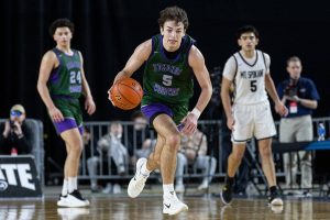 Edmonds-Woodway’s Cam Hiatt takes the ball down the court during the 3A boys semifinal game against Mt. Spokane on Friday, March 7, 2025 in Tacoma, Washington. (Olivia Vanni / The Herald)