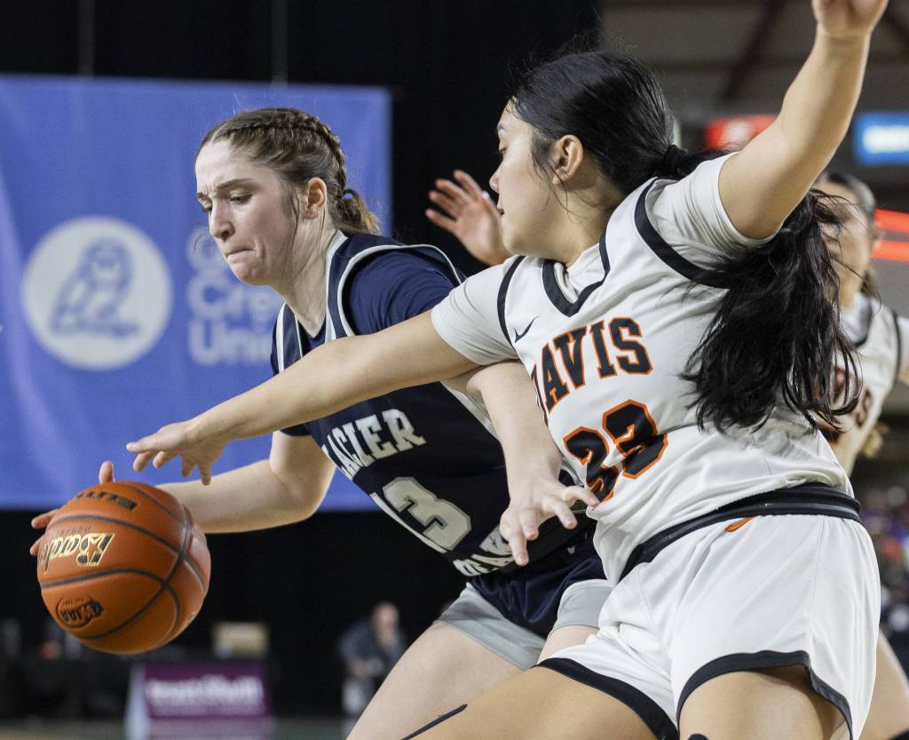 Glacier Peaks Samantha Thoma tries to maneuver around a Davis player during the 4A girls semifinal game on Friday, March 7, 2025 in Tacoma, Washington. (Olivia Vanni / The Herald)
