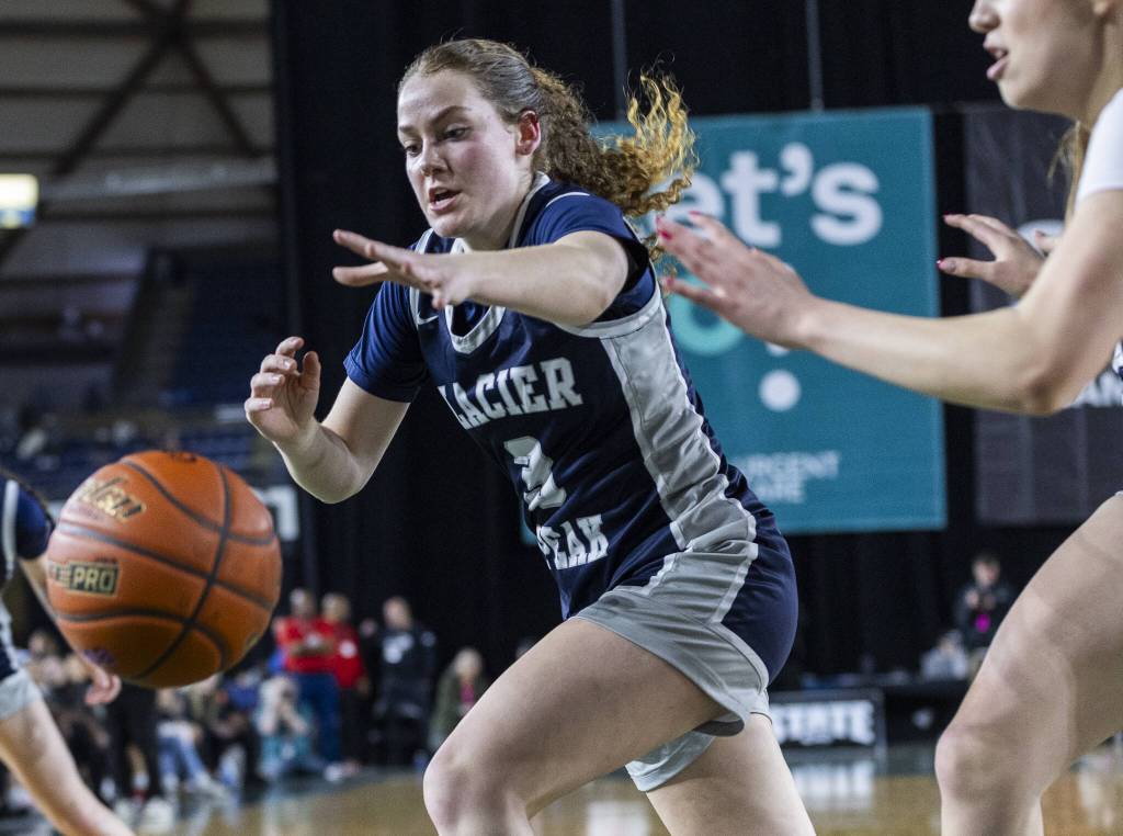 Glacier Peaks Brynna Pukis reaches out for a loose ball during the 4A girls semifinal game against Davis on Friday, March 7, 2025 in Tacoma, Washington. (Olivia Vanni / The Herald)