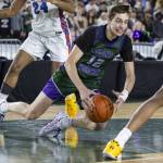 Edmonds-Woodways William Alseth falls to the ground during the 3A boys championship game against Rainier Beach on Saturday, March 8, 2025 in Tacoma, Washington. (Olivia Vanni / The Herald)