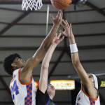 Edmonds-Woodways William Alseth and Rainier Beachs Marques Ili-Meneese and Nyale Robinson reach up for a rebound during the 3A boys championship game on Saturday, March 8, 2025 in Tacoma, Washington. (Olivia Vanni / The Herald)