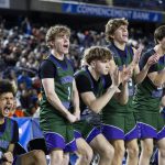 The Edmonds-Woodway bench reacts to a shot during the 3A boys championship game against Rainier Beach on Saturday, March 8, 2025 in Tacoma, Washington. (Olivia Vanni / The Herald)