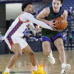 Edmonds-Woodways William Alseth tries to maneuver around the outstretched arms of Rainer Beachs Maceo Rivers during the 3A boys championship game on Saturday, March 8, 2025 in Tacoma, Washington. (Olivia Vanni / The Herald)
