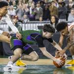 Edmonds-Woodways Dre Simonsen scrambles for a loose ball during the 3A boys championship game against Rainier Beach on Saturday, March 8, 2025 in Tacoma, Washington. (Olivia Vanni / The Herald)
