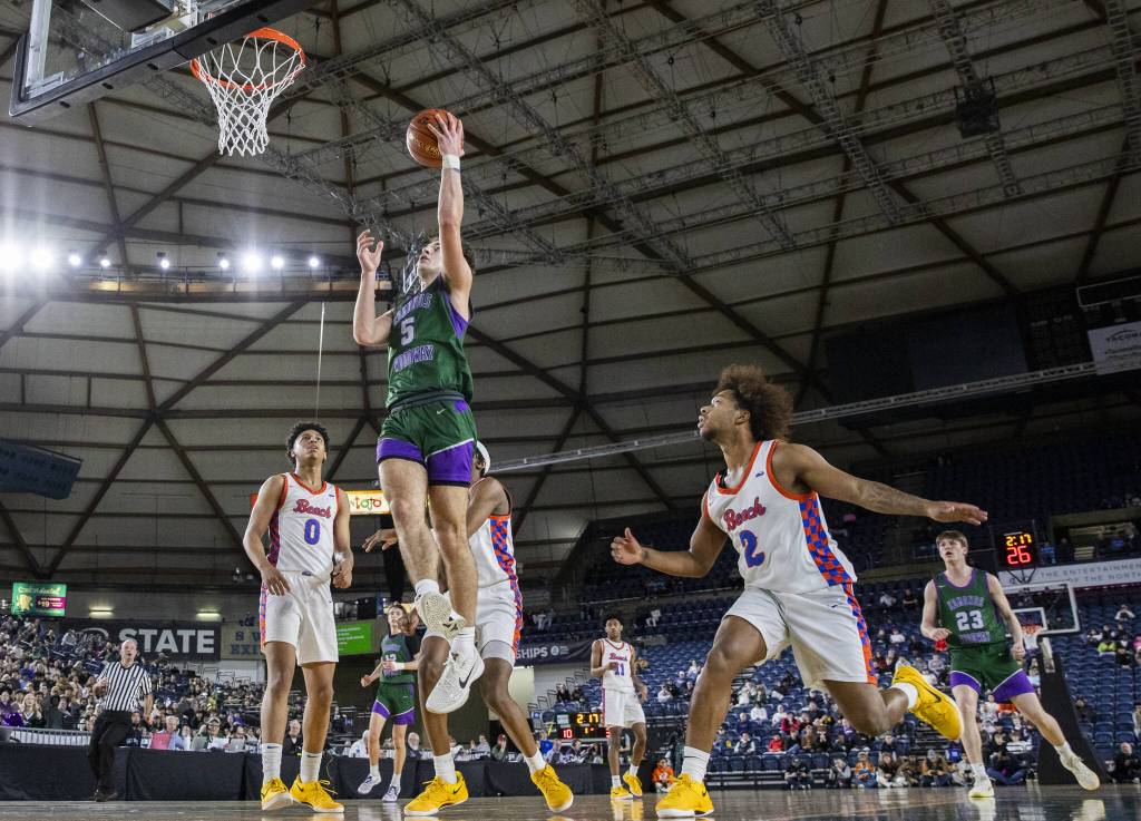 Edmonds-Woodways Cam Hiatt makes a layup during the 3A boys championship game against Rainier Beach on Saturday, March 8, 2025 in Tacoma, Washington. (Olivia Vanni / The Herald)