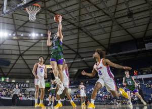 Edmonds-Woodways Cam Hiatt makes a layup during the 3A boys championship game against Rainier Beach on Saturday, March 8, 2025 in Tacoma, Washington. (Olivia Vanni / The Herald)