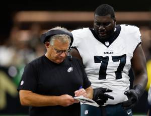 Mekhi Becton, talking to Eagles offensive line coach Jeff Stoutland, was one of the remaining guard options available in free agency as of Wednesday morning. (Yong Kim / Tribune News Services)