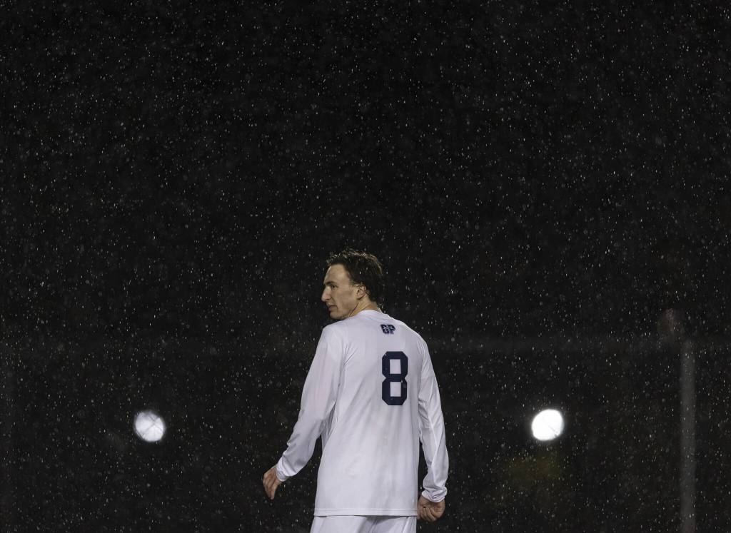 Rain comes down around Glacier Peaks Otto Nicholson during the game against Snohomish on Wednesday, March 12, 2025 in Snohomish, Washington. (Olivia Vanni / The Herald)
