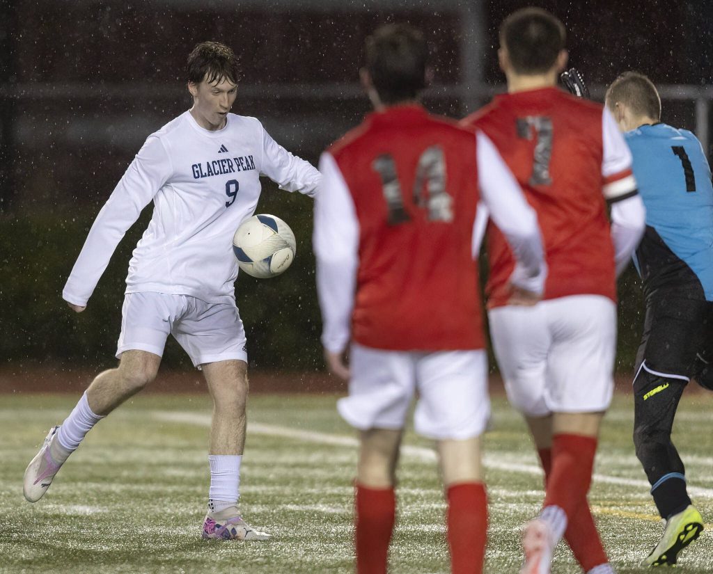 Glacier Peaks Tate Swetman takes a shot on goal during the game against Snohomish on Wednesday, March 12, 2025 in Snohomish, Washington. (Olivia Vanni / The Herald)