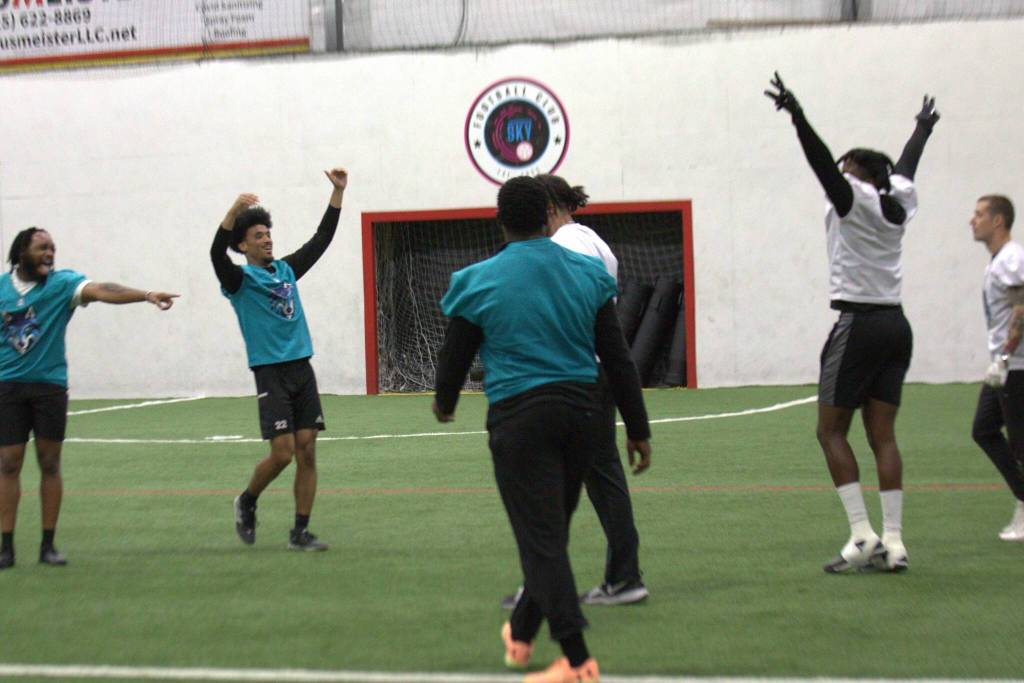 The Wolfpack defense celebrates after breaking up a pass during the Arena Football One teams practice at Snohomish Sports Dome on Thursday, March 13, 2025. (Aaron Coe / The Herald)