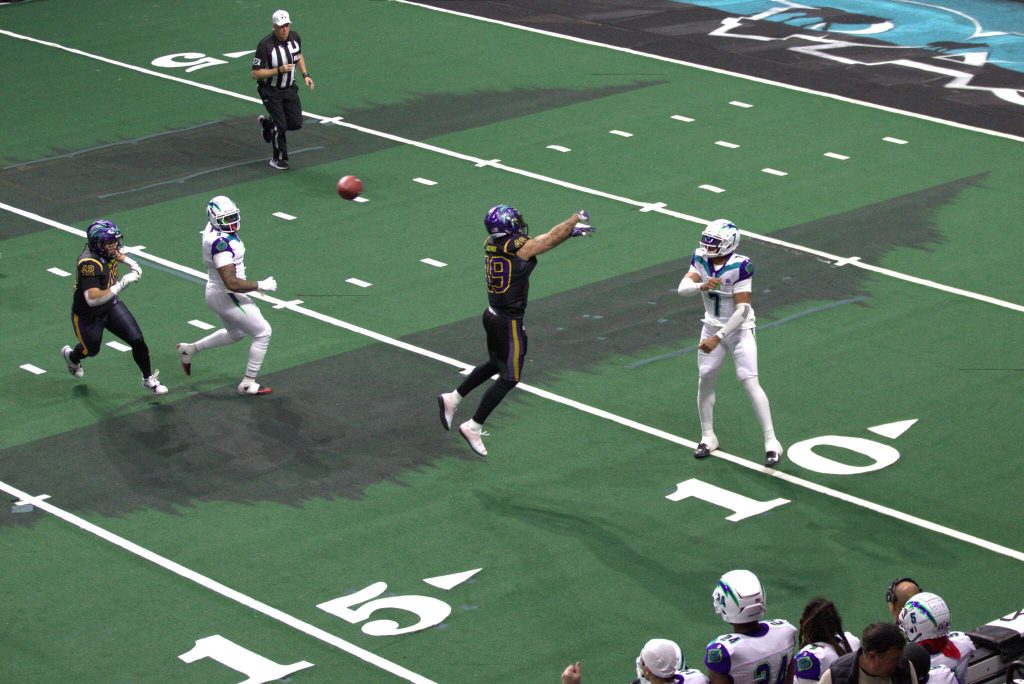 Washingtons Deshon Williams (49) tries to bat down a pass during the Wolfpacks 63-33 loss at Angel of the Winds Arena on March 16, 2025. (Aaron Coe / The Herald)