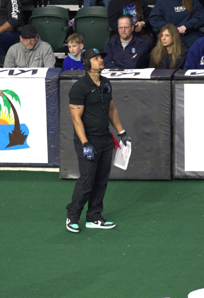 Washington coach J.R. Wells looks up after a conference with quarterback Adam Kruse during the Washington Wolfpacks 63-33 loss at Angel of the Winds Arena on March 16, 2025. (Aaron Coe / The Herald)