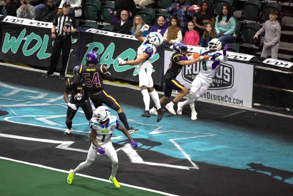 A pass sales over the head of Southwest Kansas receiver Demarius Washington (0) as Wolfpack defensive back Machiah Lee (3) defends during the Washington Wolfpacks 63-33 loss at Angel of the Winds Arena on March 16, 2025. (Aaron Coe / The Herald)