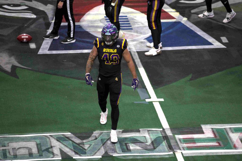 Deshon Williams (49) looks for the defensive call from the sideline after his Wolfpack logo had come off during the game. Washingtons uniforms were not received in time for the game at Angel of the Winds Arena on March 16, 2025 due to a shipping issue. (Aaron Coe / The Herald)