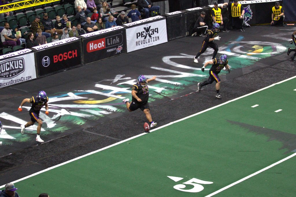 Manny Higuera (53) kicks off the 2025 season for the Washington Wolfpack at Angel of the Winds Arena on March 16, 2025. (Aaron Coe / The Herald)