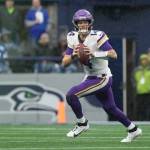 While with the Minnesota Vikings, Sam Darnold looks to throw a pass against the Seattle Seahawks at Lumen Field on Dec. 22, 2024. (Christopher Mast / Getty Images / The Athletic)