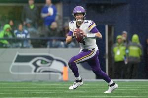 While with the Minnesota Vikings, Sam Darnold looks to throw a pass against the Seattle Seahawks at Lumen Field on Dec. 22, 2024. (Christopher Mast / Getty Images / The Athletic)