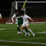 Shorewood senior Matthew Bereket fends off Edmonds-Woodway senior Joey Dornay during the first half of Shorewood's 2-1 overtime win in Edmonds, Washington on March 18, 2025. (Joe Pohoryles / The Herald)