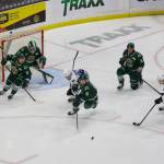 Everett Silvertips winger Dominik Rymon (center) drives toward the puck after a failed Wenatchee shot in Everett's 5-0 win against the Wild in Everett, Washington on March 21, 2025. Rymon is flanked by, from left to right, defenseman Landon DuPont, winger Jesse Heslop, defenseman Eric Jamieson and center Julius Miettinen, while goalie Jesse Sanche is squared in net behind them. (Joe Pohoryles / The Herald)