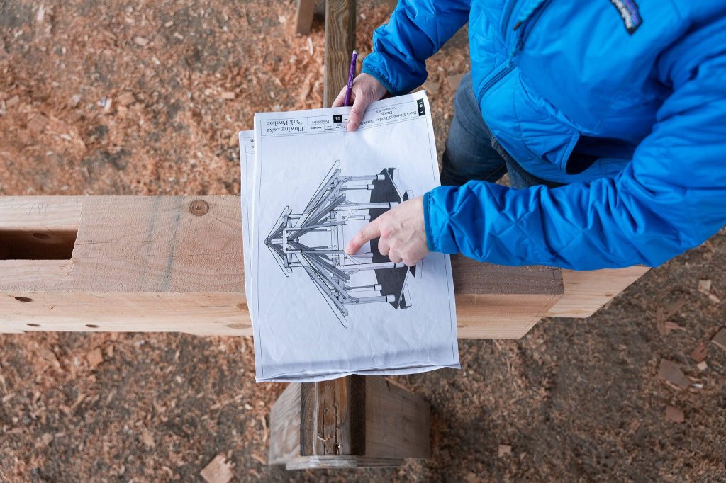Elaina Jorgensen points to a design of the gathering space on Wednesday, March 19 in Monroe, Washington. (Will Geschke / The Herald)