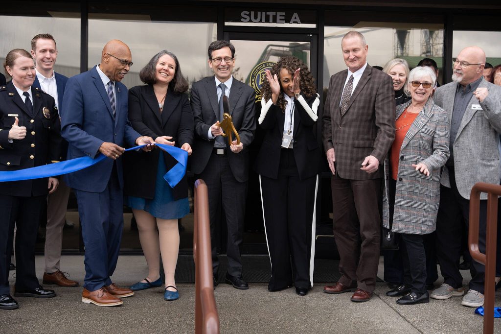 Gov. Bob Ferguson cuts a ribbon at the opening of the Washington State Criminal Justice Training Commissions Northwest Regional Campus on Thursday, March 20 in Arlington, Washington. (Will Geschke / The Herald)