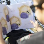 Oliver Popa shows one of his favorite pages in his book on Tuesday, March 25, 2025 in Edmonds, Washington. (Olivia Vanni / The Herald)