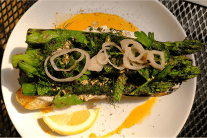 LJs Bistro in Lake Stevens serves up a steak knife-worthy asparagus toast ($14), with whipped feta, local asparagus, fresh herbs, zaatar and pickled shallot atop grilled bread. (Taylor Goebel / The Herald)