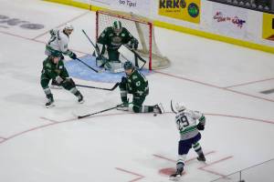 Everett Silvertips defenseman Kaden Hammell (47) kneels to block a shot from Seattle Thunderbirds forward Nathan Pilling (29 in white) during the Silvertips' 3-2 overtime win in Game 2 of the 2025 WHL Playoffs First Round at Angel of the Winds Arena in Everett, Washington on March 29, 2025. (Joe Pohoryles / The Herald)